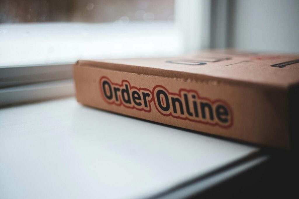 Cardboard box labeled “Order Online,” symbolizing what free shipping means in eCommerce and how it shapes online shopping behavior.